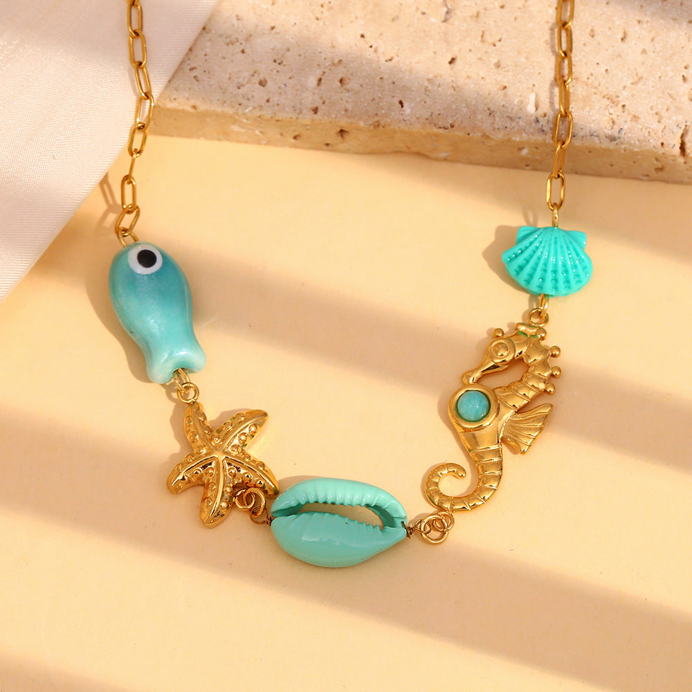 Ocean Eyes Pendant Necklace – Seahorse, Shell & Starfish in 18K Gold