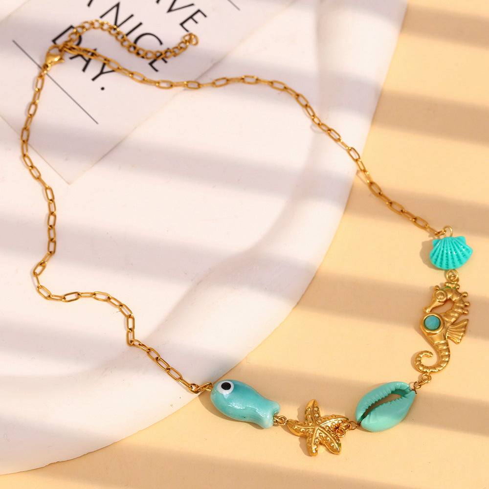 Ocean Eyes Pendant Necklace – Seahorse, Shell & Starfish in 18K Gold