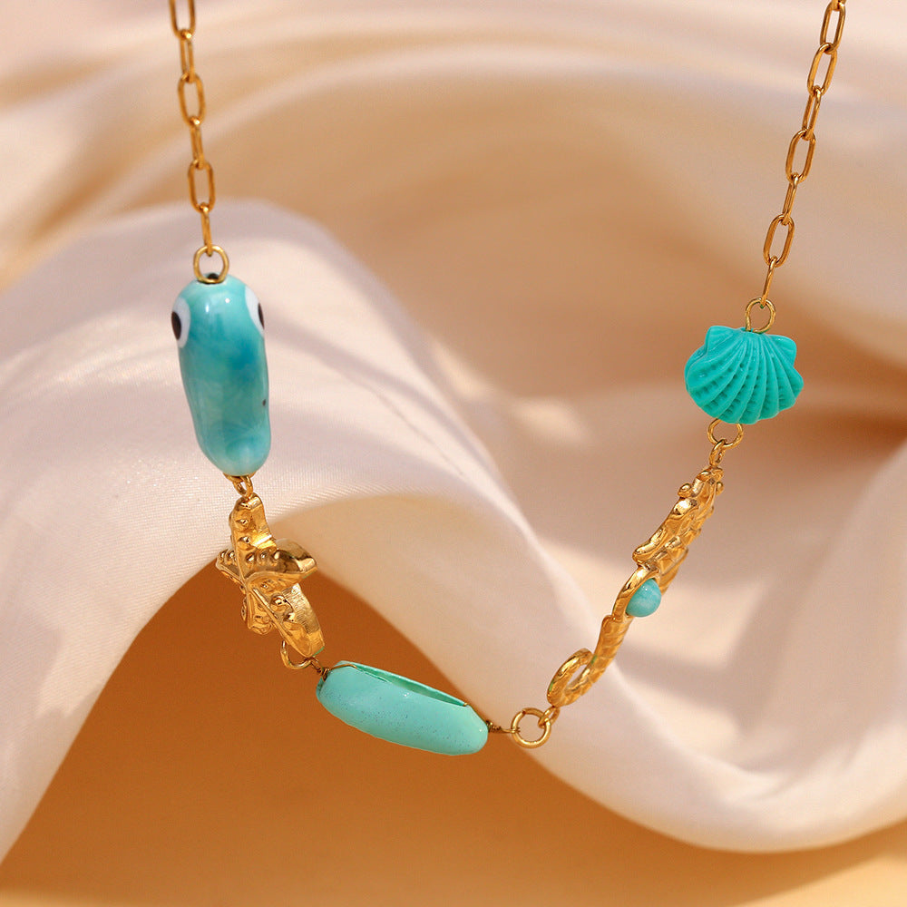 Ocean Eyes Pendant Necklace – Seahorse, Shell & Starfish in 18K Gold